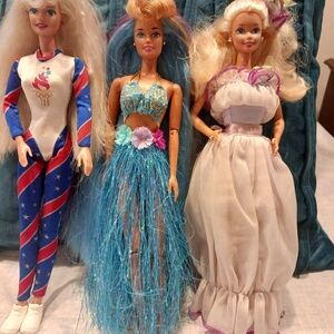 Set of Twelve Fashion Dolls with Colorful Outfits